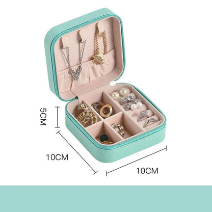 Portable mini jewelry storage box with compartments, mint green, travel-friendly size, 10x10x5cm, velvet-lined interior for necklaces, rings, earrings.