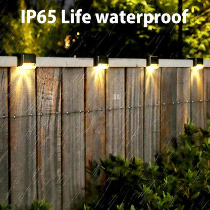 Garden Solar LED Lights with IP65 waterproof rating illuminating a fence.