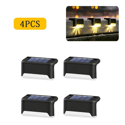 4-piece set of Garden Solar LED Lights with warm light, IP65 waterproof, energy-efficient for outdoor use.