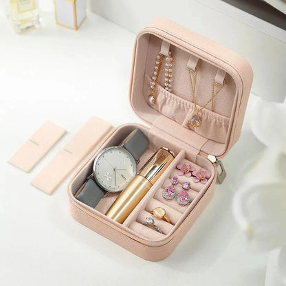 Portable Mini Jewelry Storage Box with multiple compartments and velvet-lined interior.