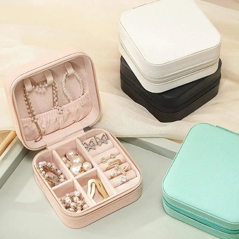 Portable Mini Jewelry Storage Box with multi-compartment design, perfect for travel and home use, available in various colors.