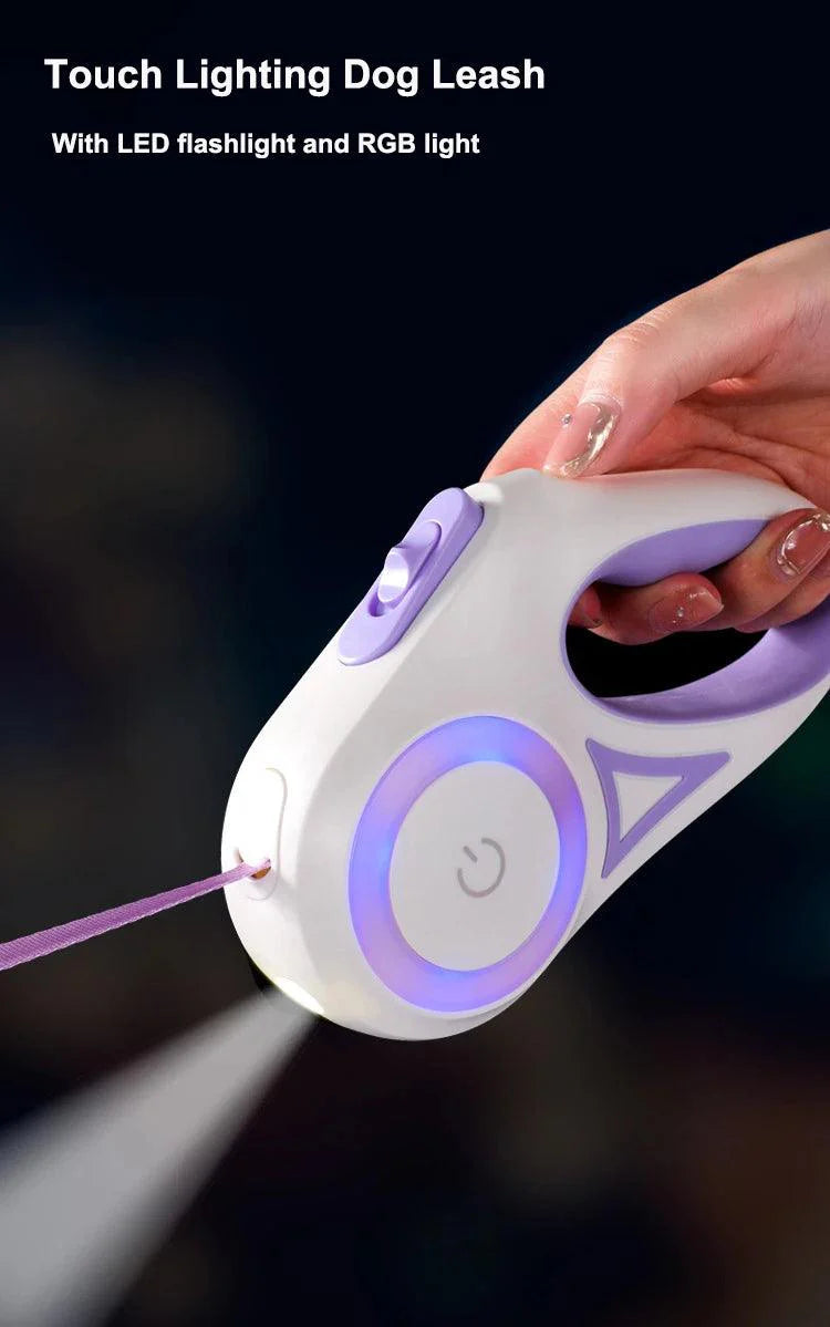 Automatic retractable dog leash with LED light in hand, featuring ergonomic design and anti-slip handle.