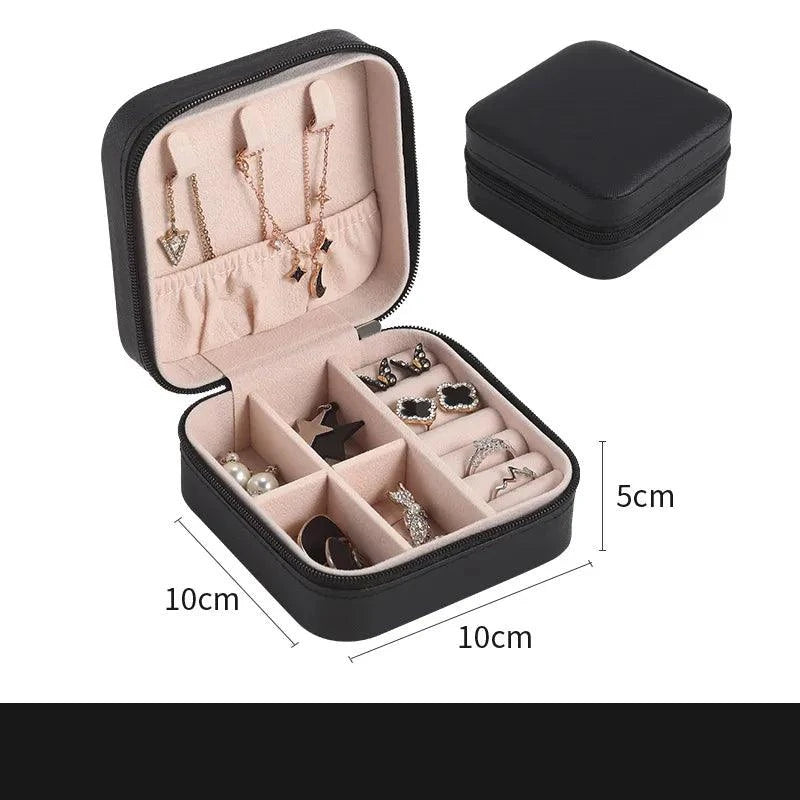 Portable Mini Jewelry Storage Box with multi-compartment design, black exterior, and velvet-lined interior, measuring 10x10x5cm.