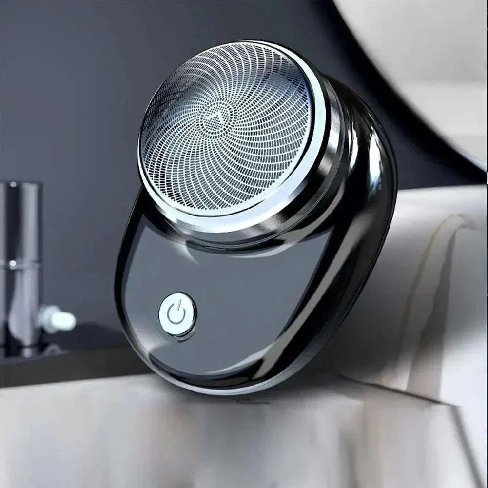 Compact mini portable electric shaver with sleek design, ideal for dry and wet use.