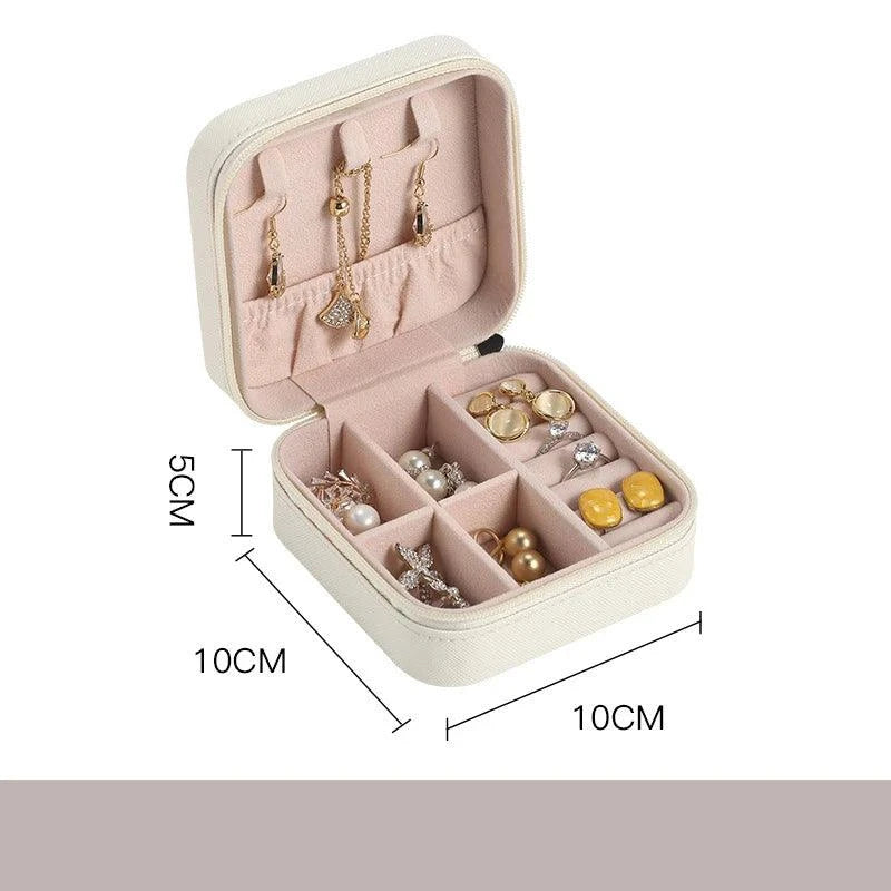 Portable Mini Jewelry Storage Box with multi-compartment design, perfect for travel, measuring 10x10x5 cm.